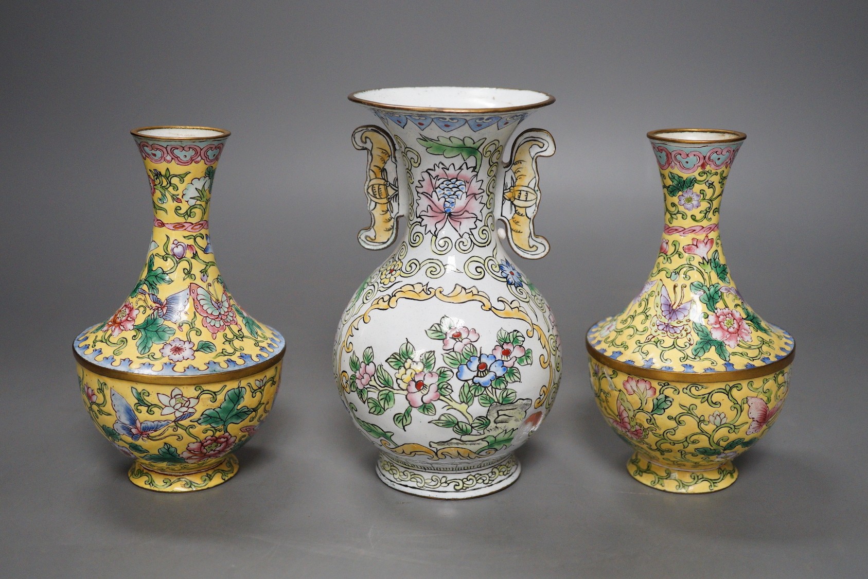 A pair of Chinese Guangzhou yellow enamel vases and another similar vase, tallest 15cms high.